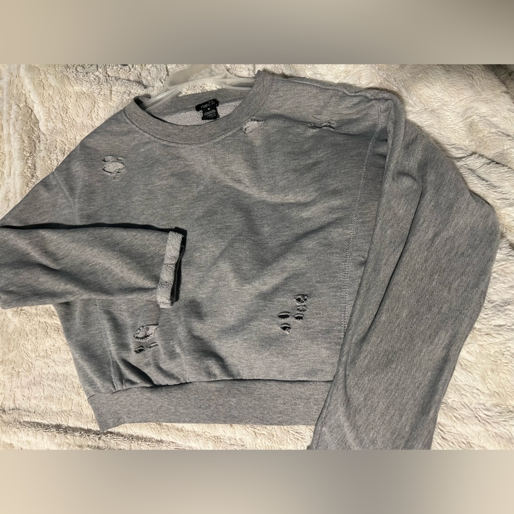 Gray cropped sweater with little torn holes for looks